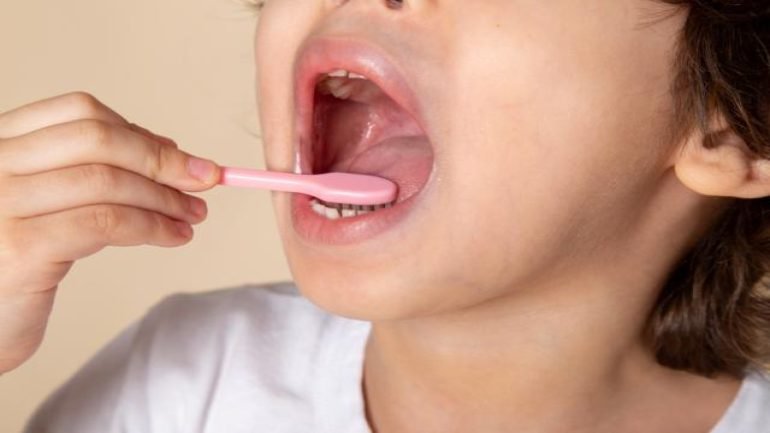 close-up-view-little-boy-cleaning-his-teeth.jpg