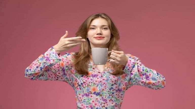 front-view-young-woman-likes-smell-her-tea.jpg