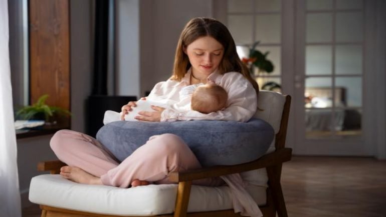 woman-using-nursing-pillow-home-newborn-baby.jpg
